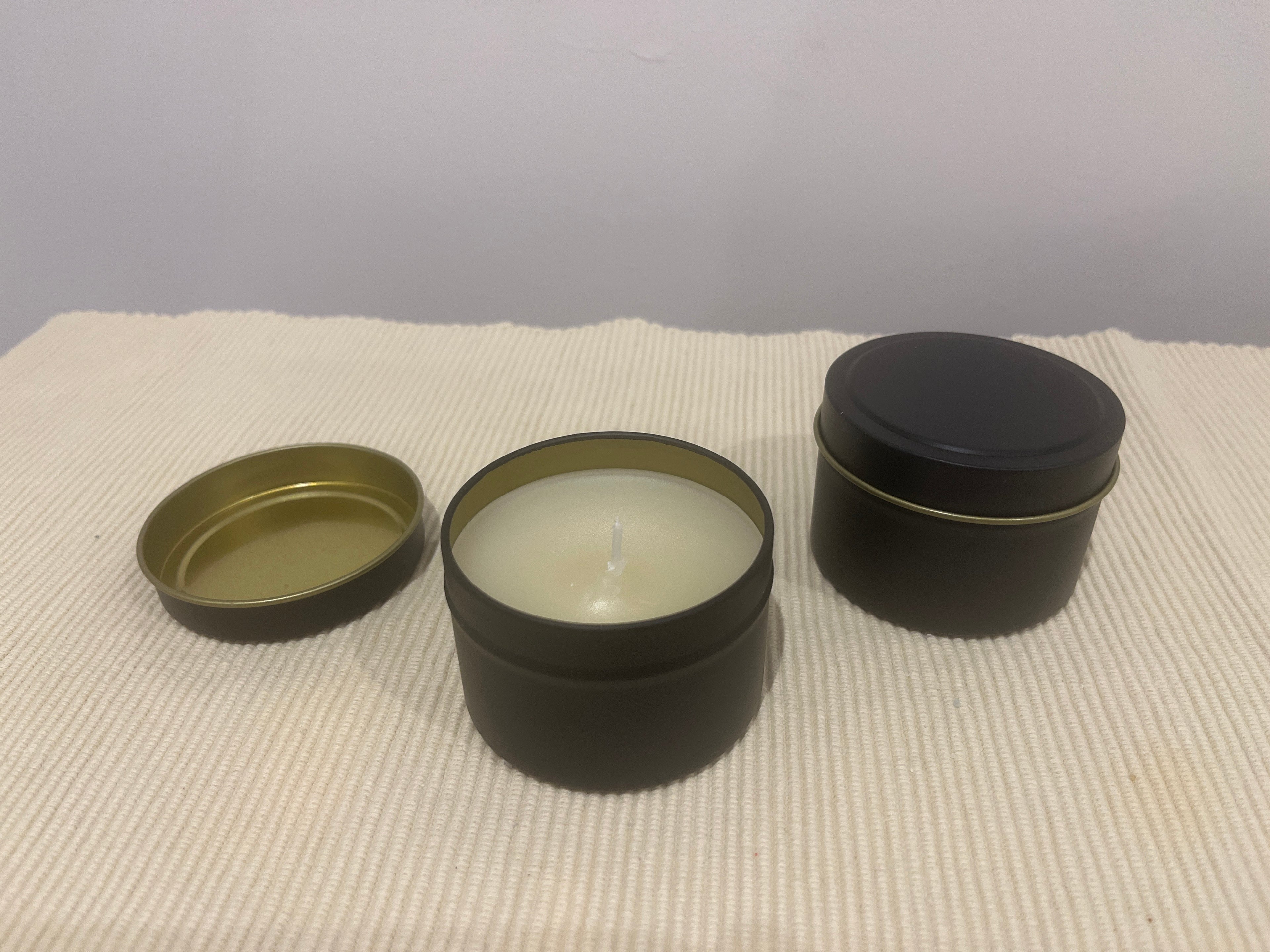 Scented candles in tins
